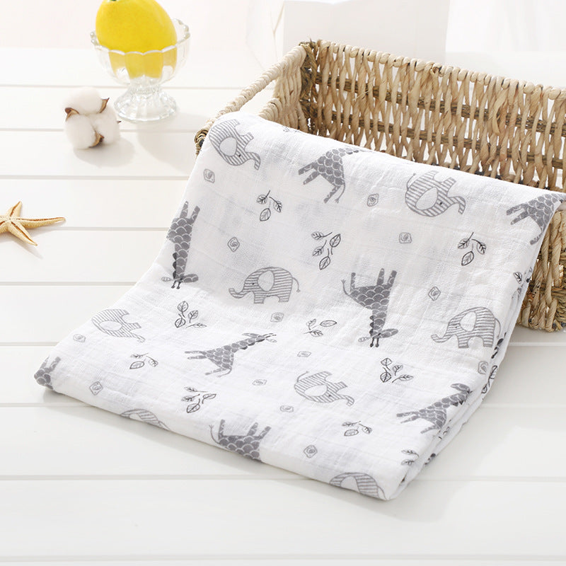 Baby blanket with animal pattern on a white surface
